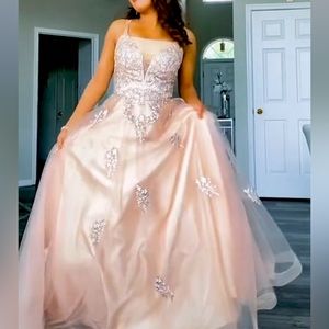 A gorgeous nude dress with beautiful flowers.